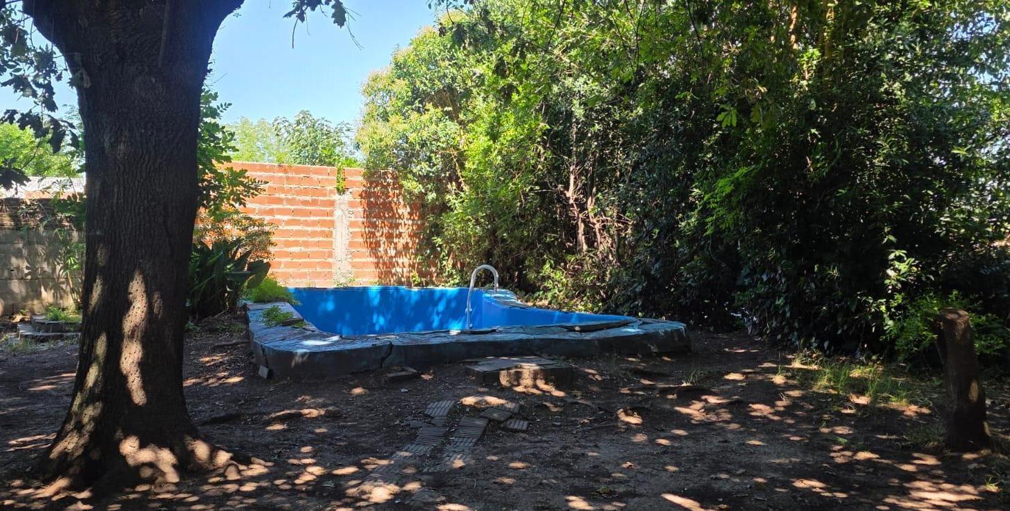 Casa sobre dos terrenos