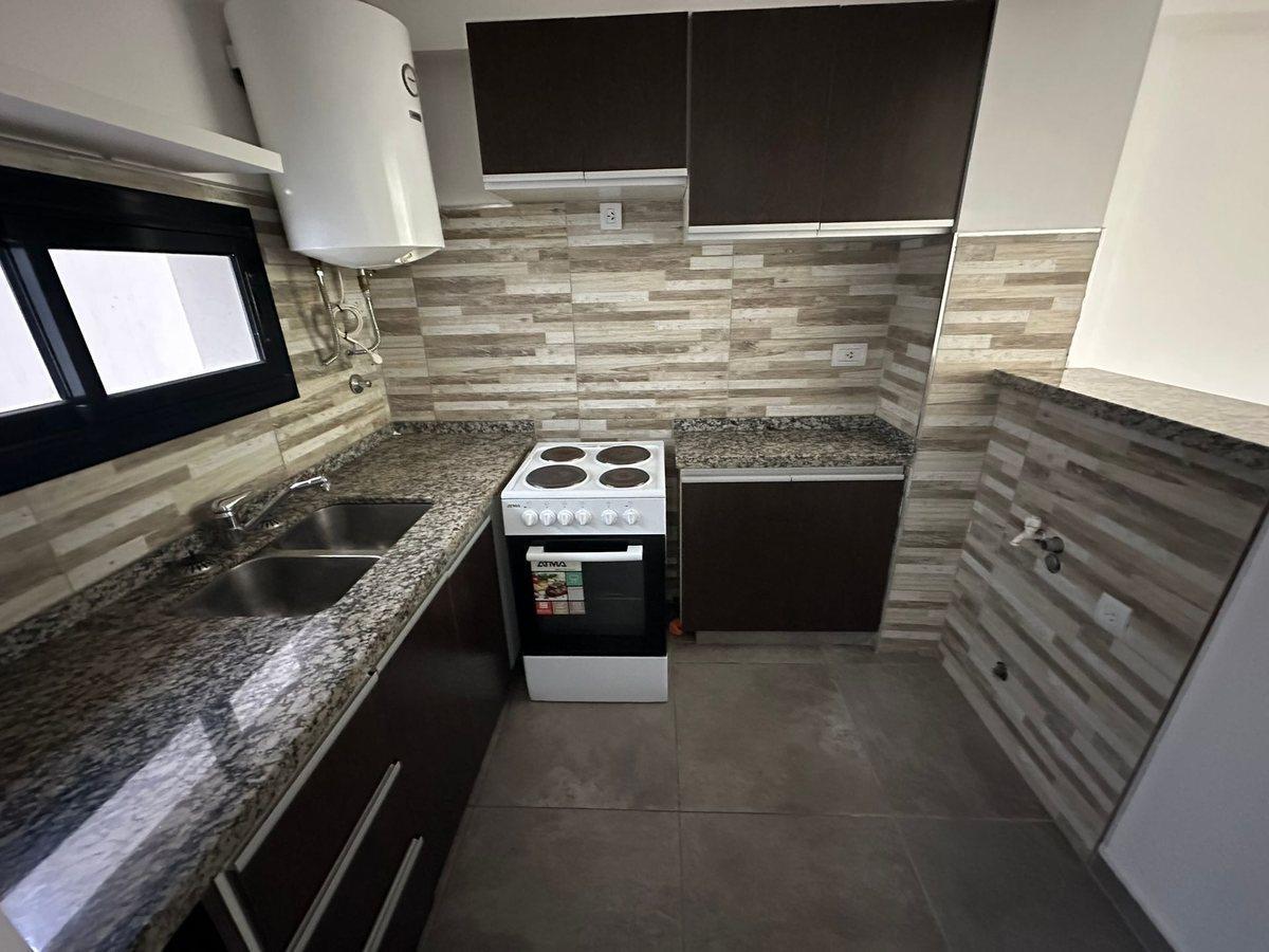 Foto de VENTA DEPARTAMENTO 1 DORMITORIO CON PATIO LOURDES, imagen 1