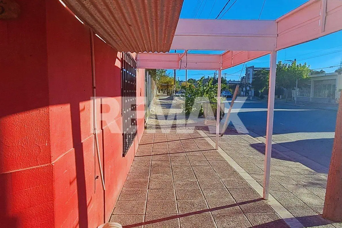 Venta Local  y Terreno centro Centenario 400 m2 4