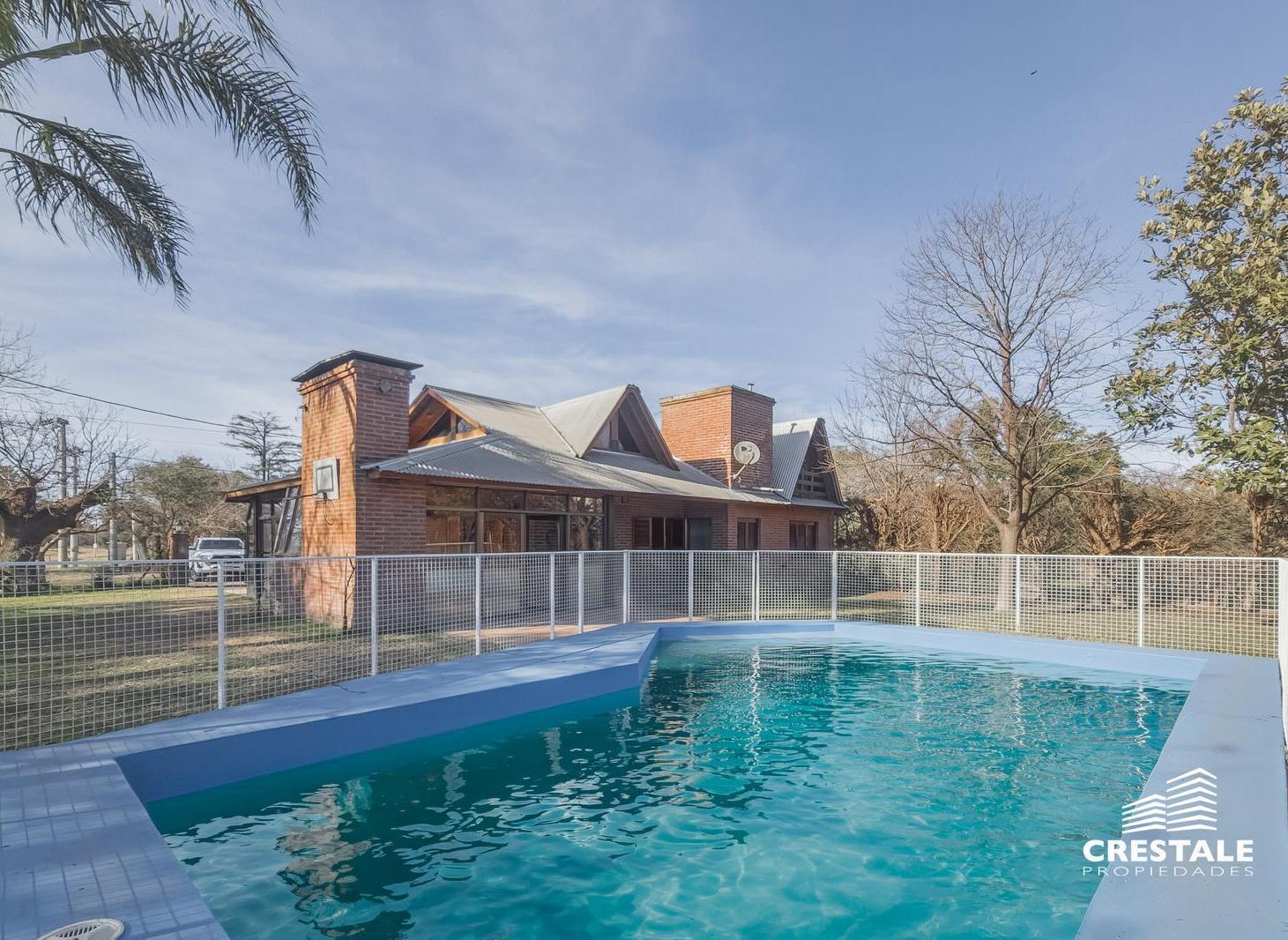 Foto de Venta / Permuta - Casa 4 dormitorios con quincho y pileta - Funes, Santa Fe., imagen 1