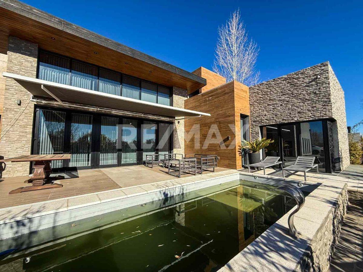 Foto de VENTA CASA 4 DORM + ESTUDIO - CANALES DE PLOTTIER, imagen 1