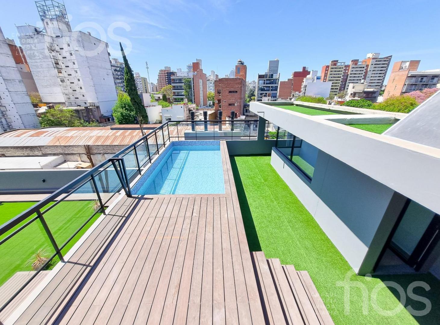 VENTA DEPARTAMENTO A ESTRENAR DE DOS DORMITORIOS CON BALCON, COCHERA Y AMENITIES ABASTO