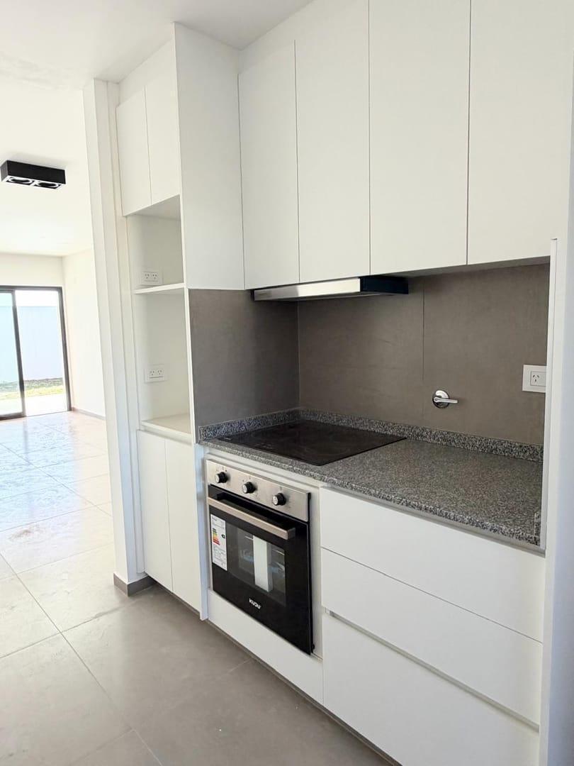 Foto de DUPLEX EN PLANTA BAJA PAMPAS DE MANANTIALES EXCELENTE CALIDAD, imagen 1