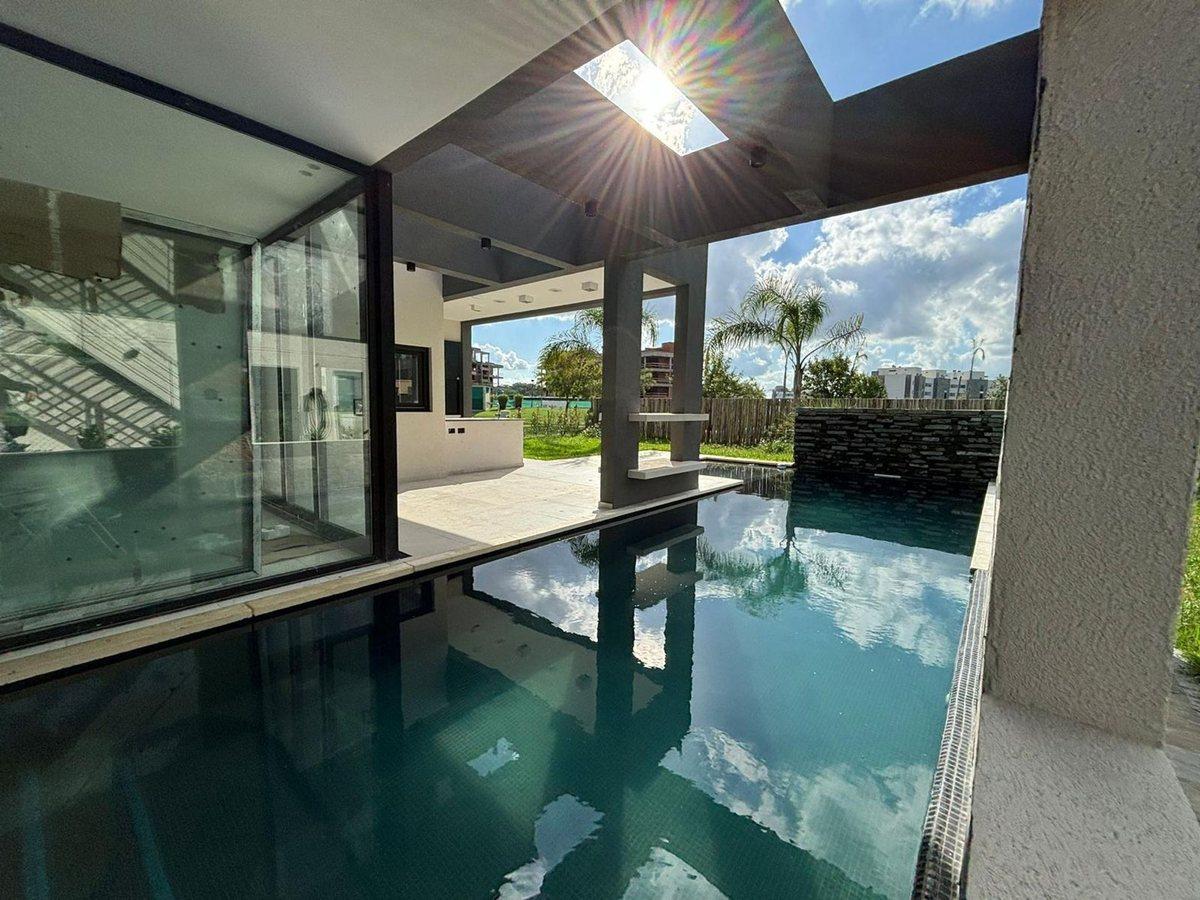Foto de VENTA ESPECTACULAR CASA A ESTRENAR EN LAGOON PILAR, imagen 4