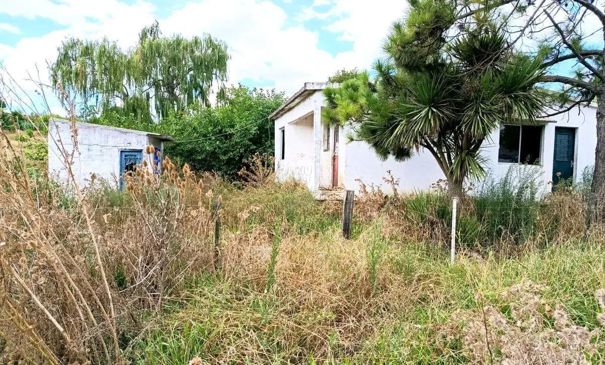 Venta de terreno con construcción  en Pando 5