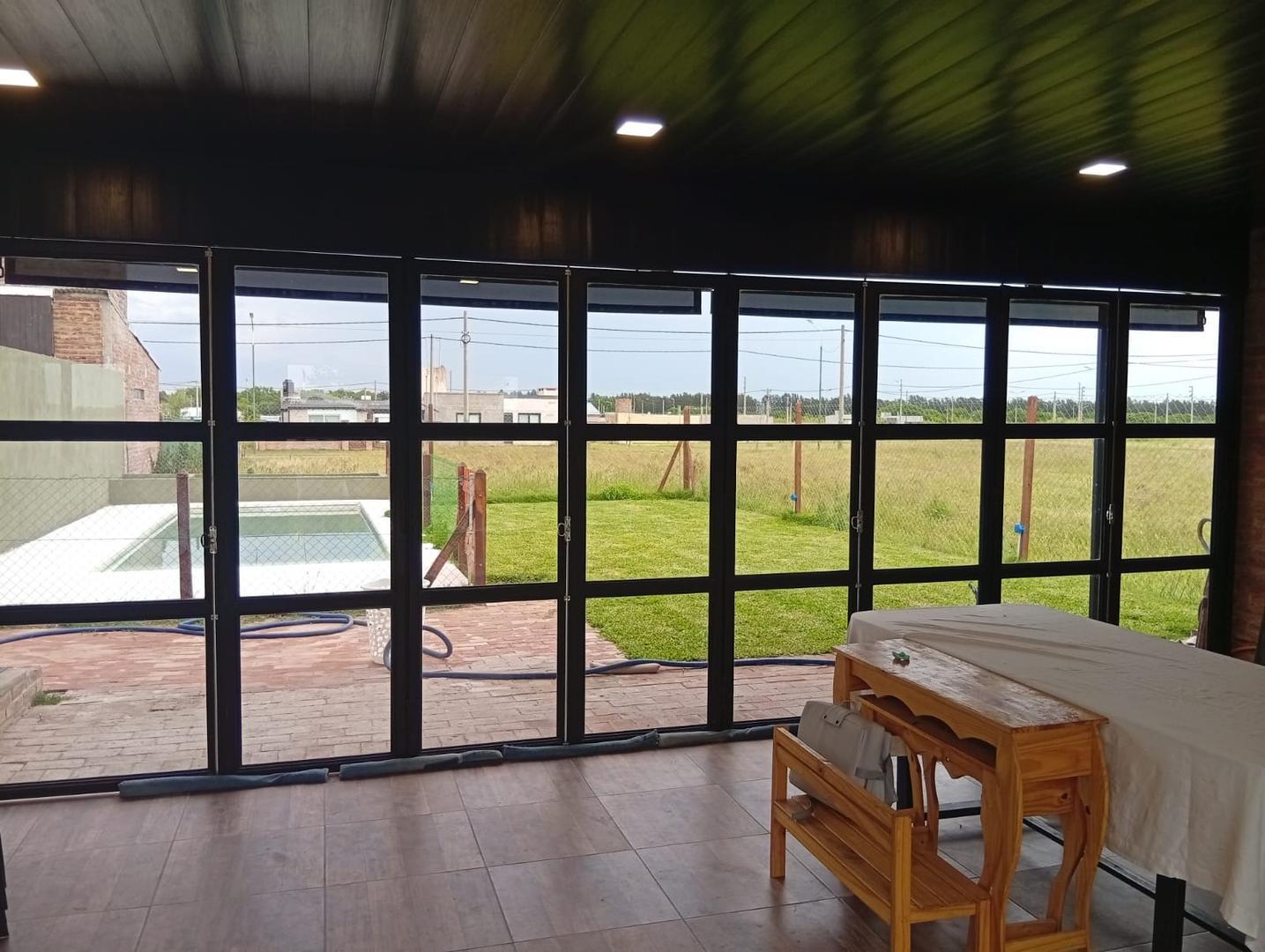 Foto de QUINCHO EN VENTA, BAÑO Y PISCINA LOTE DE 300M2 EN LA TOSCANA, imagen 4