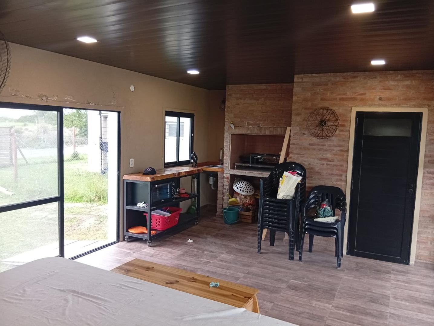 Foto de QUINCHO EN VENTA, BAÑO Y PISCINA LOTE DE 300M2 EN LA TOSCANA, imagen 5