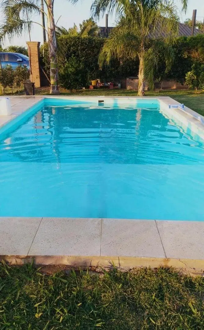 Casa con jardín y pileta en Roldan 4