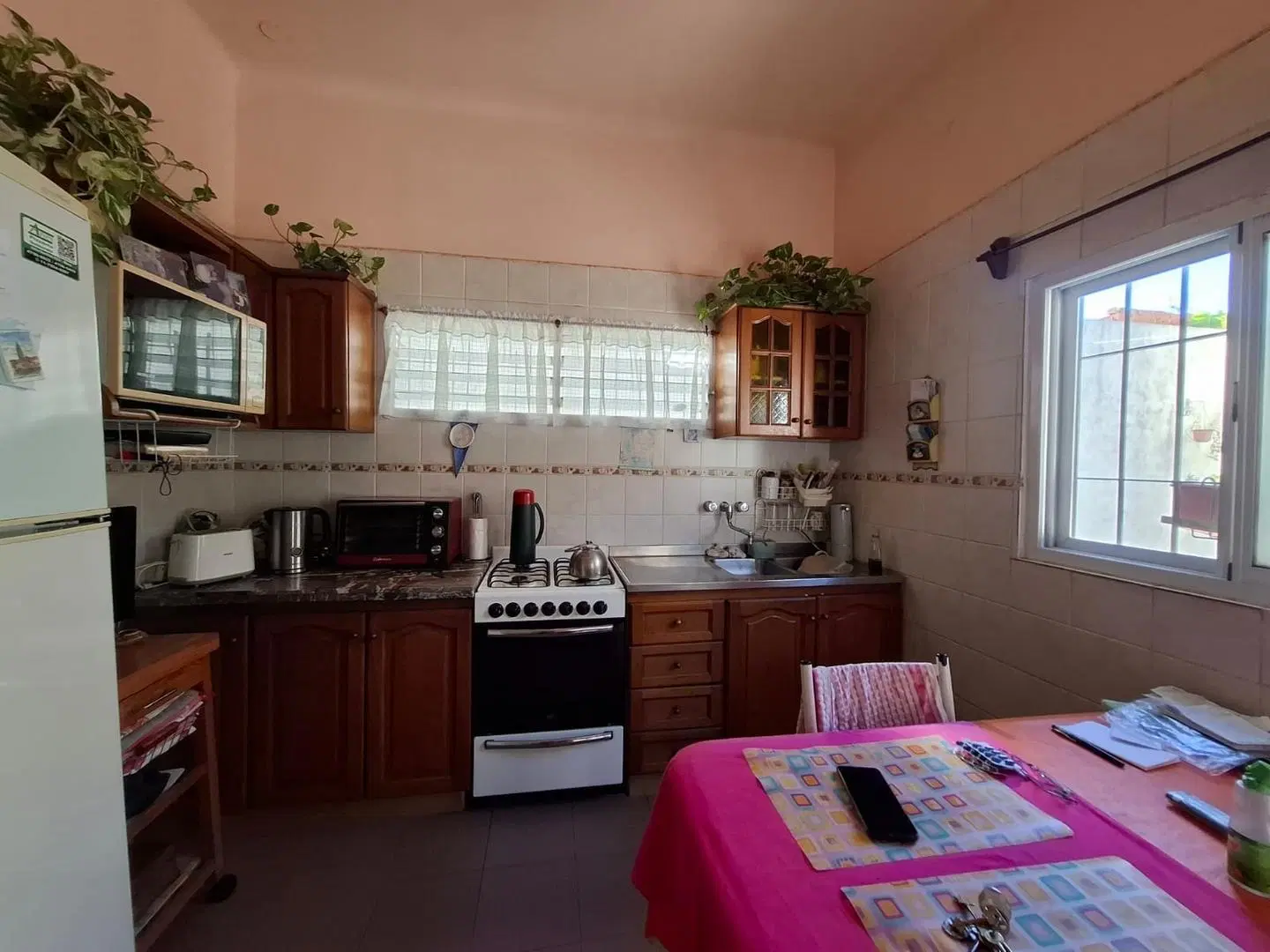 Casa c/jardín y cochera ideal dos familias 4