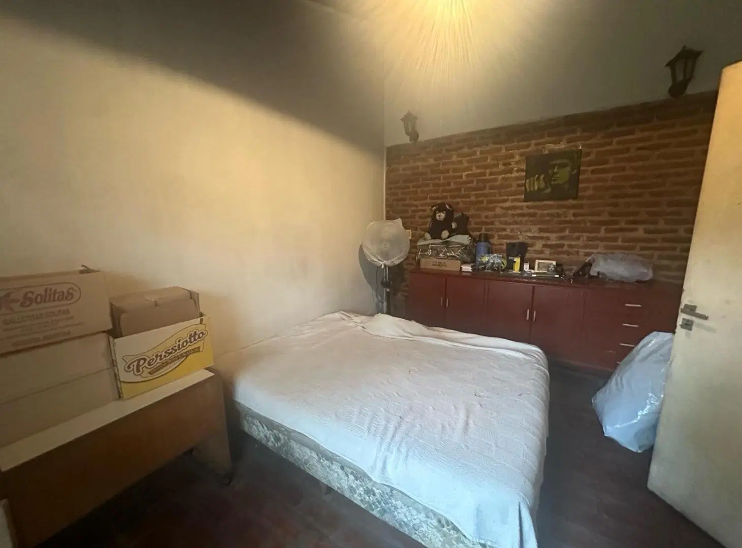 Amplio ph de 4 ambientes más un departamento y jardín 2