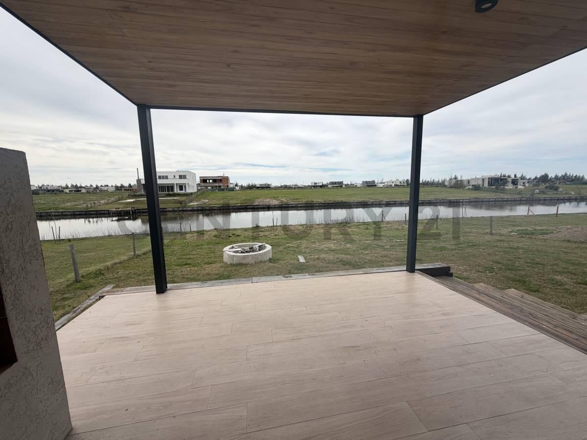 Foto de VENTA CASA 5 AMBIENTESEN EL NAUDIR LOTE CON SALIDA AL RIO A ESTRENAR, imagen 4