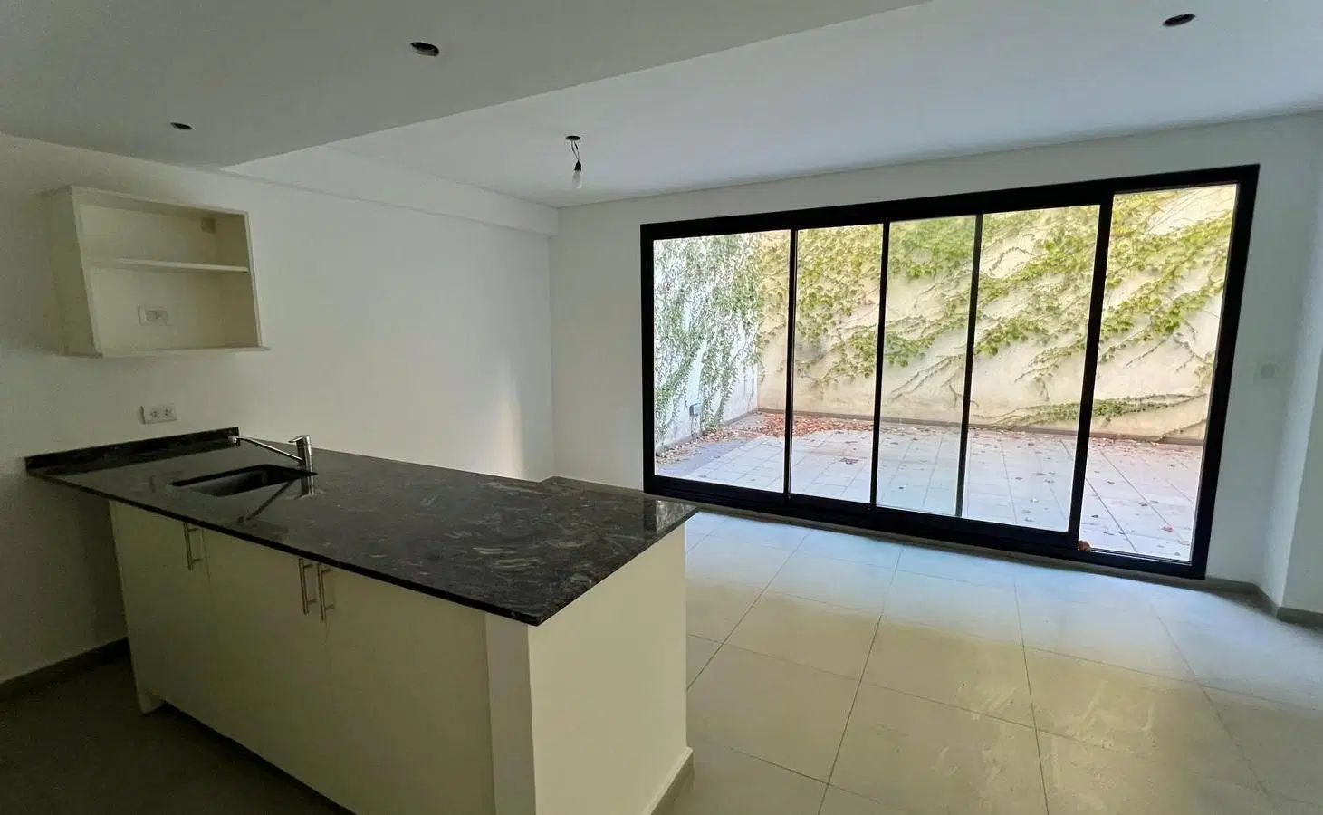 DEPARTAMENTO EN ALQUILER DE 1 DORMITORIO CON PATIO Y COCHERA 5