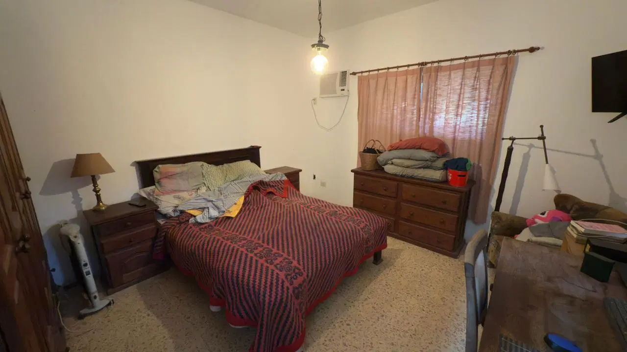 Venta casa de 2 dormitorios con amplio jardín parquizado, barrio Los Naranjos Granadero Baigorria 4