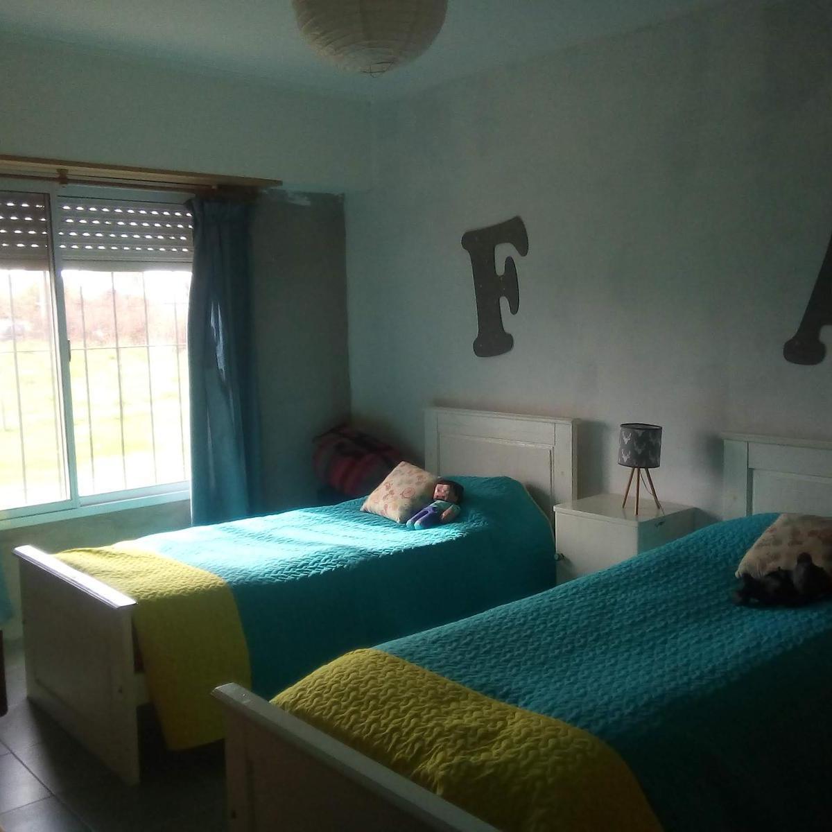 Foto de CASA EN VENTA 3AMB - CALLE MAR CHIQUITA Y NECOCHEA - LOBOS - APTO, imagen 4