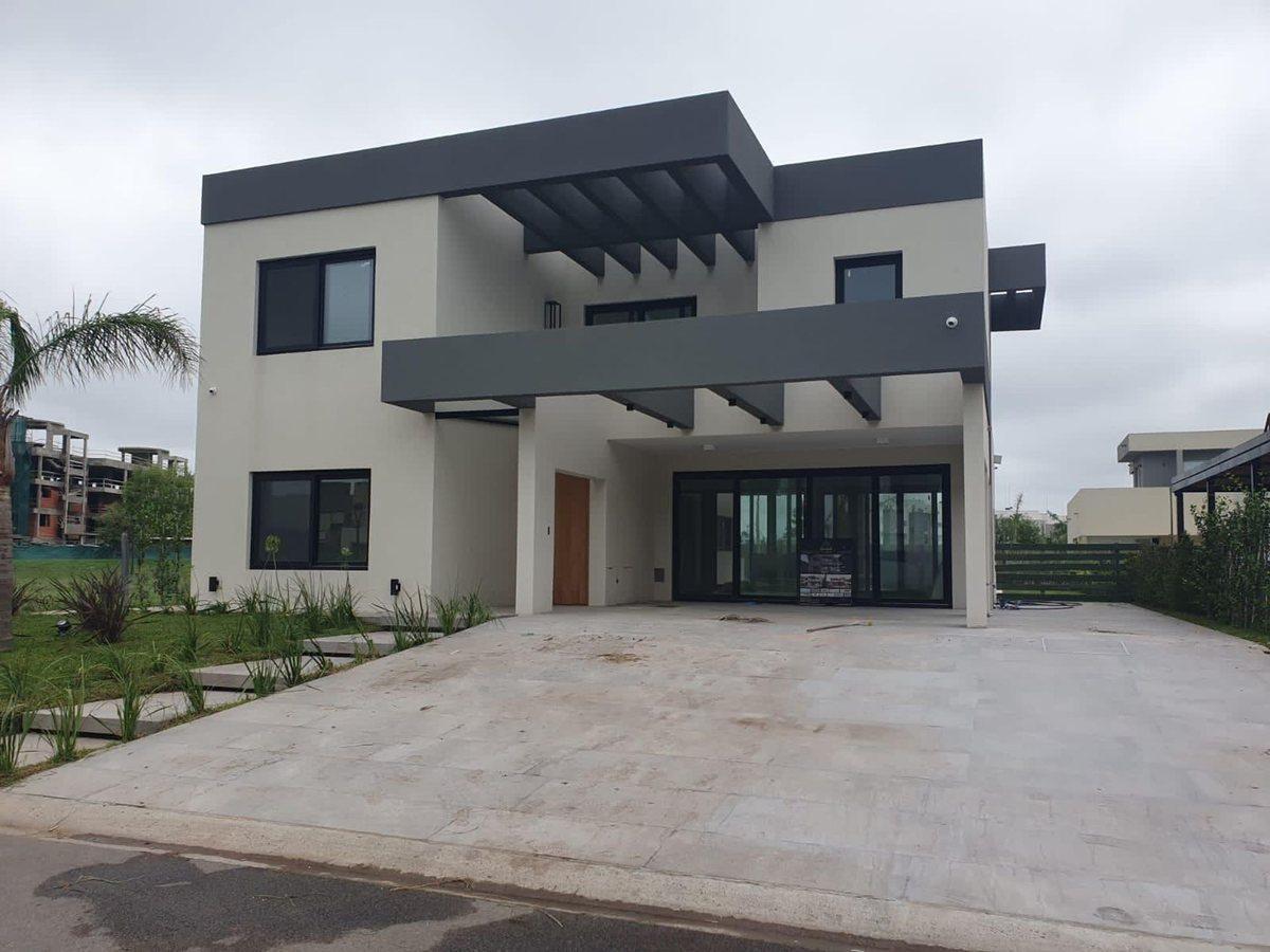 Foto de VENTA ESPECTACULAR CASA A ESTRENAR EN LAGOON PILAR, imagen 2