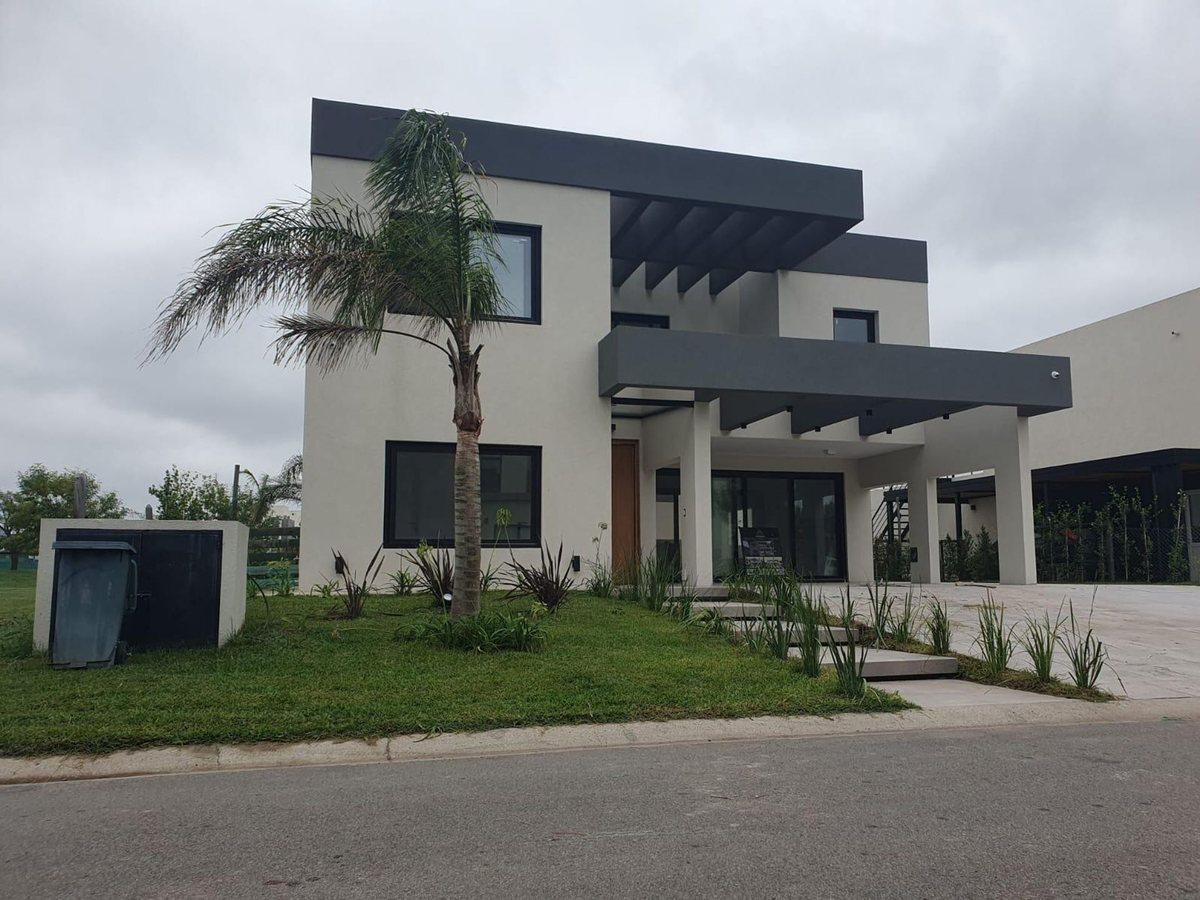 Foto de VENTA ESPECTACULAR CASA A ESTRENAR EN LAGOON PILAR, imagen 1