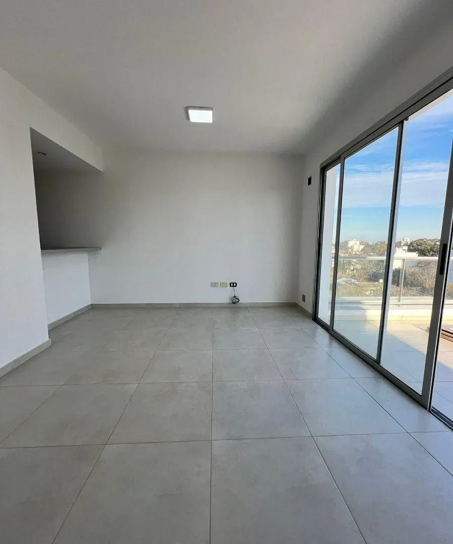 Departamento de dos dormitorios con cochera en alquiler 3