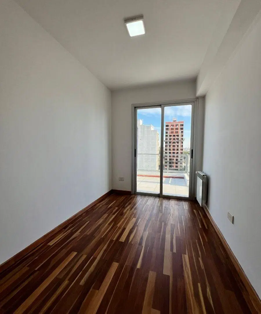 Departamento de dos dormitorios con cochera en alquiler 8