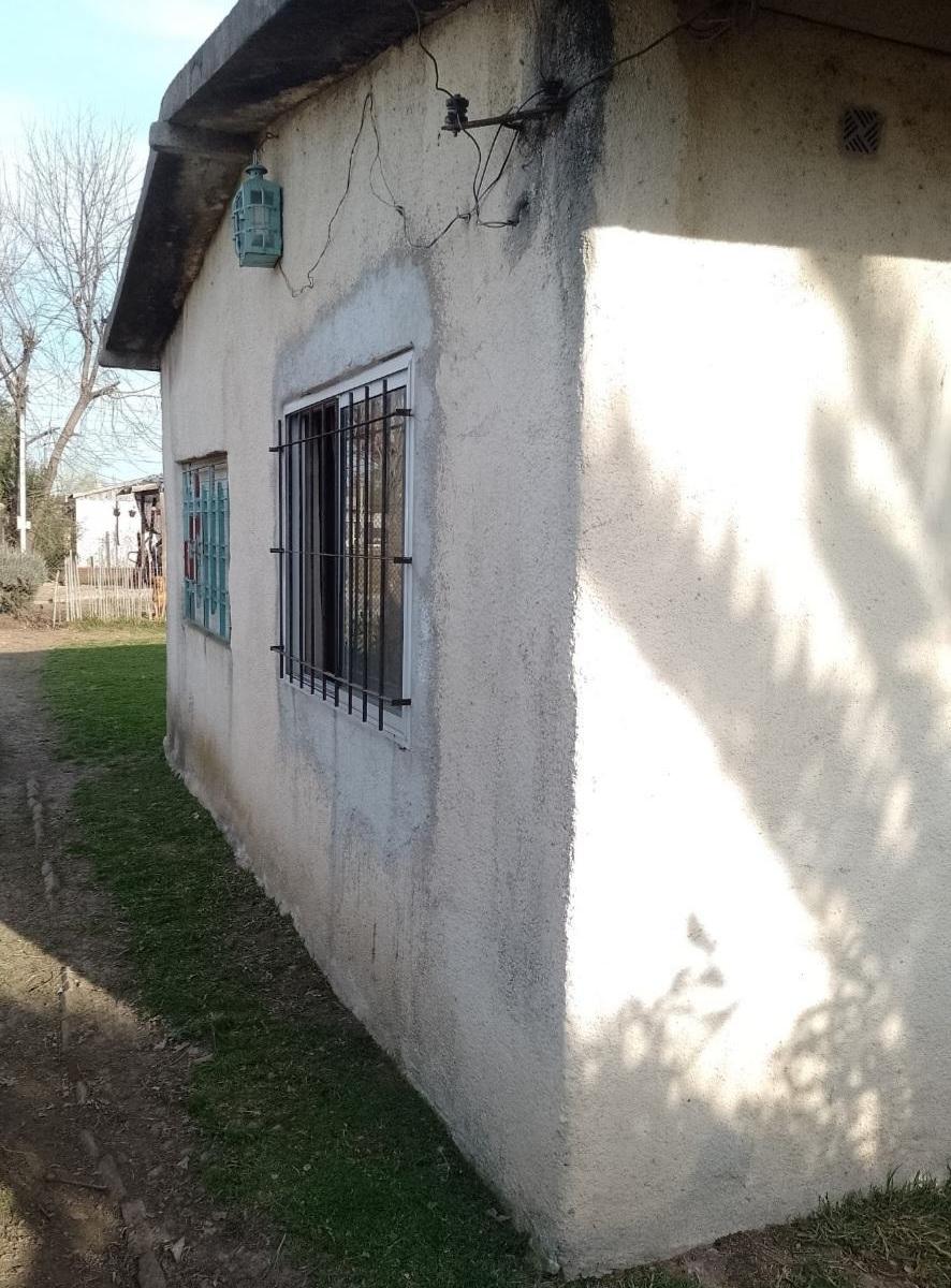 CASA Y LOTE LINDERO