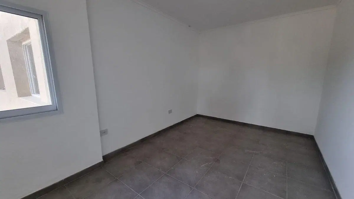 DEPARTAMENTO DE 2 DORMITORIOS CON COCHERA Y PATIO 3