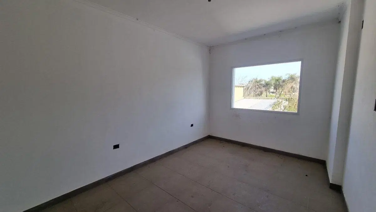 DEPARTAMENTO DE 2 DORMITORIOS CON COCHERA Y PATIO 4
