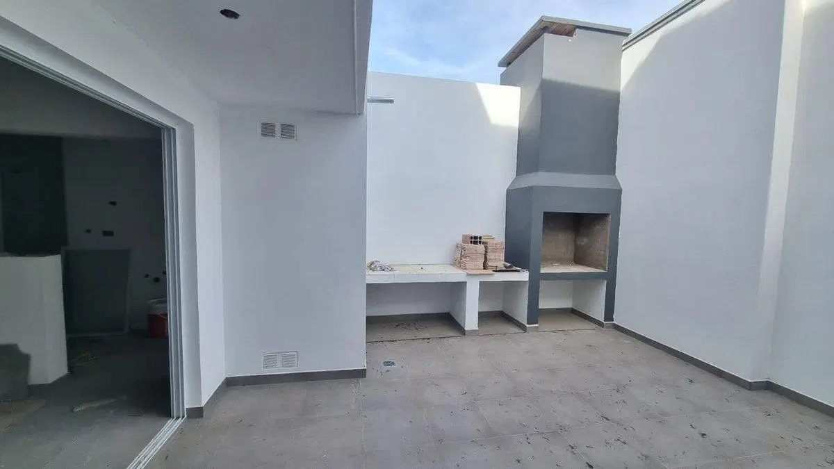 DEPARTAMENTO DE 2 DORMITORIOS CON COCHERA Y PATIO 4