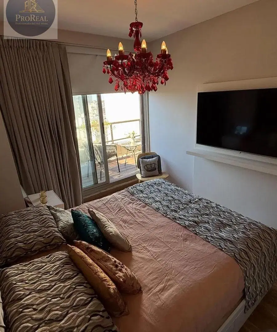 Exclusivo 2 ambientes amoblado, Piso alto, vista abierta y cochera cubierta 2