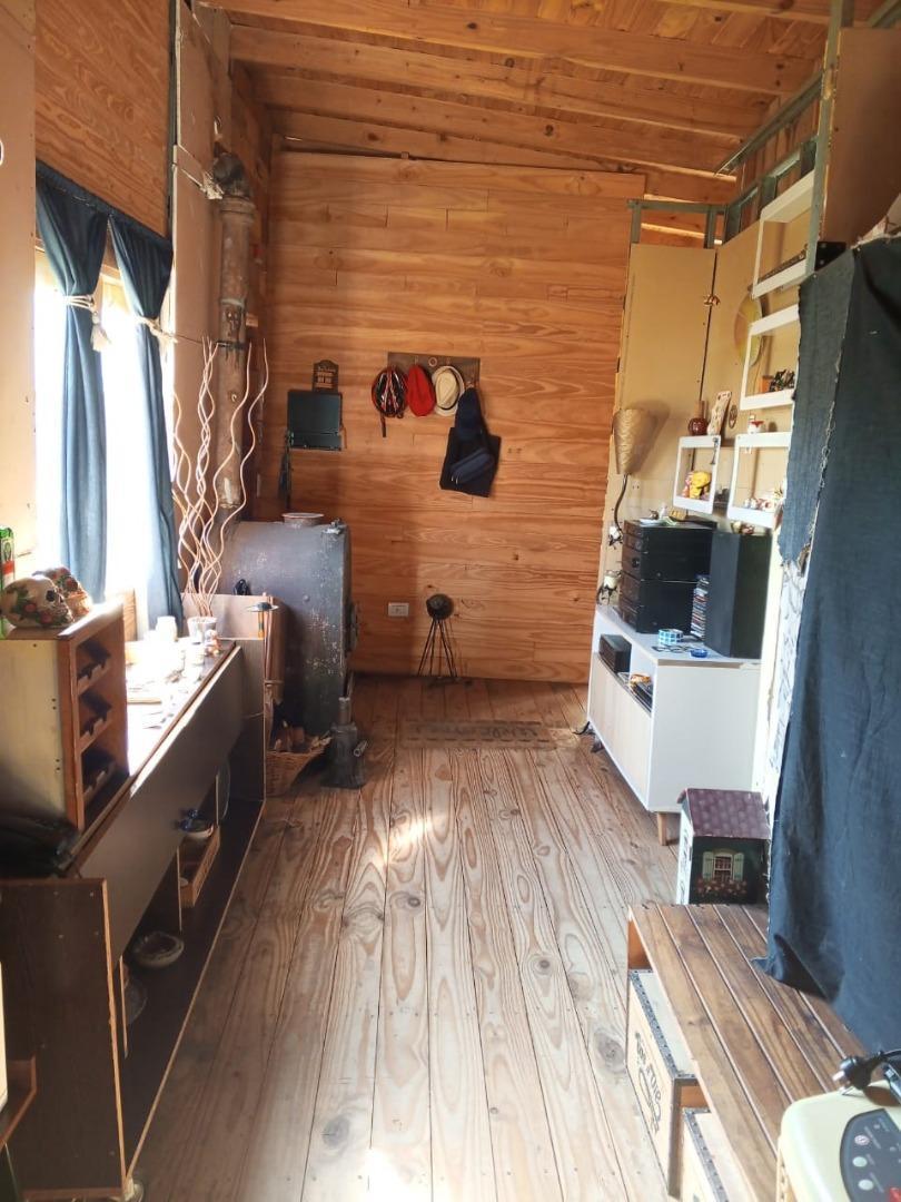 Casa estilo cabaña, construida en sistema woodframe.