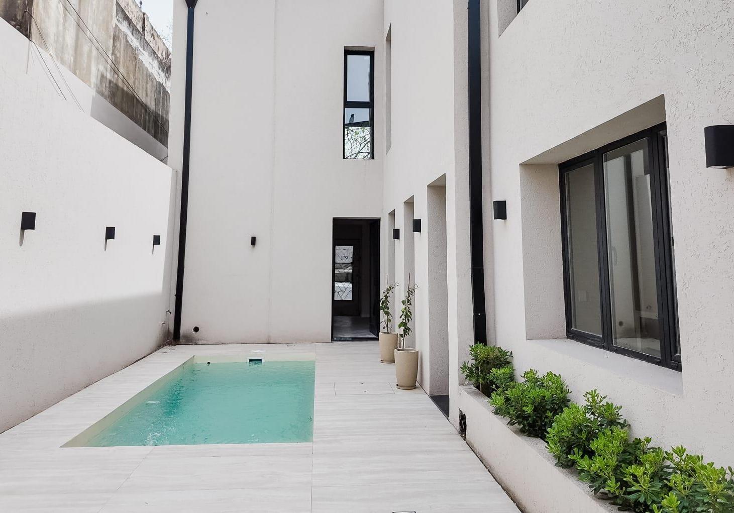 Foto de CASA 4 DORMITORIOS PILETA COCHERA MITRE 2200 ABASTO ROSARIO, imagen 2