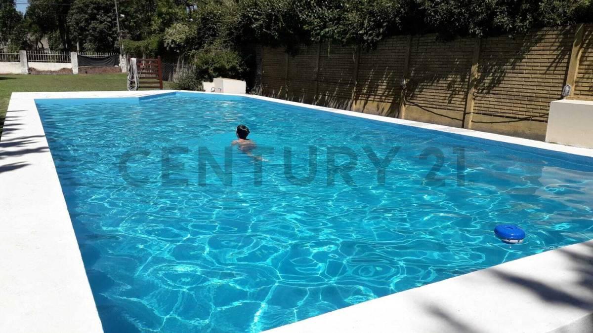 Foto de VENTA LOTE CON PISCINA Y MEJORAS EN FUNES, imagen 3