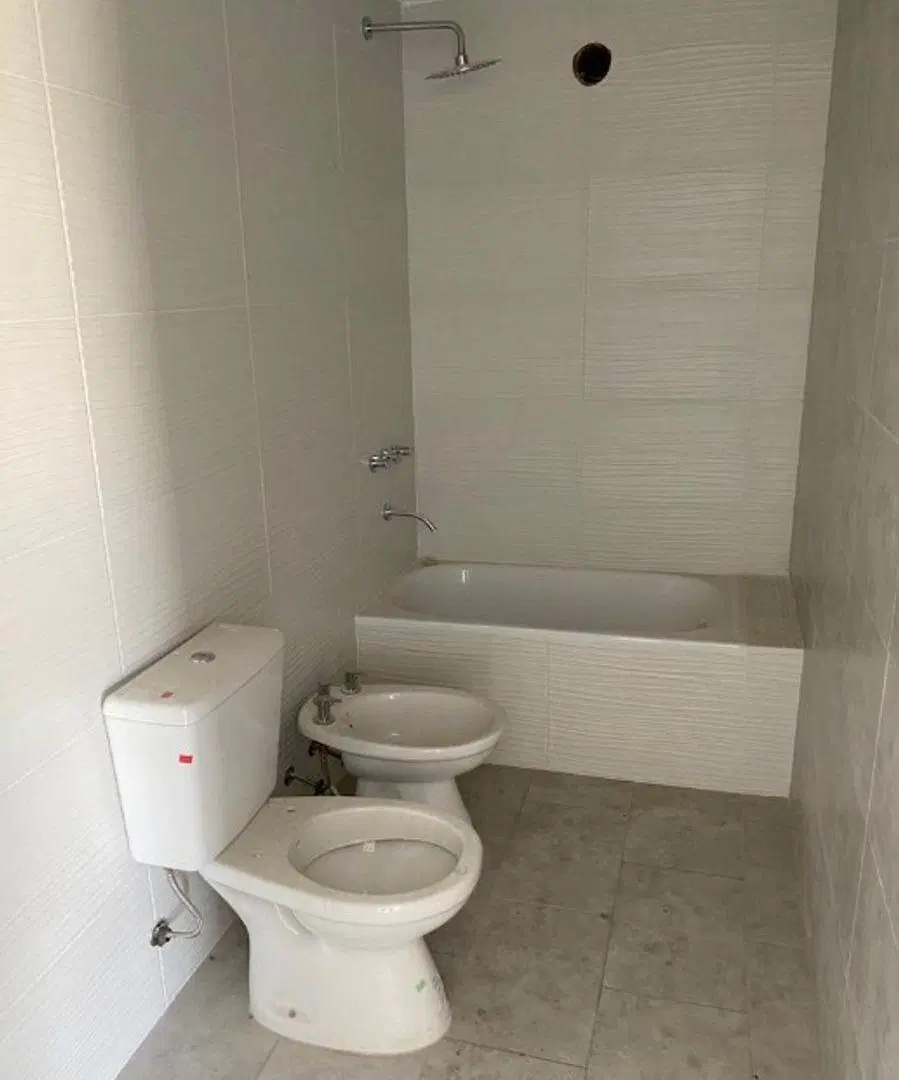 DEPARTAMENTO DE 2 AMBIENTES EN PLANTA BAJA CON COCHERA DESCUBIERTA 4