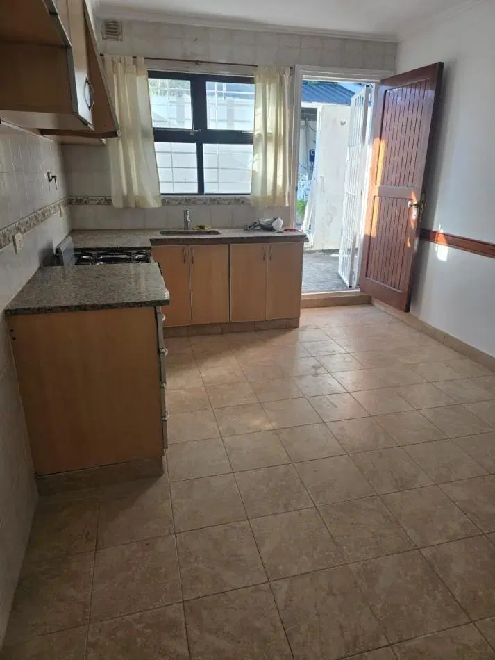 DEPARTAMENTO DE 2 AMBIENTES CON PATIO Y GARAGE 1