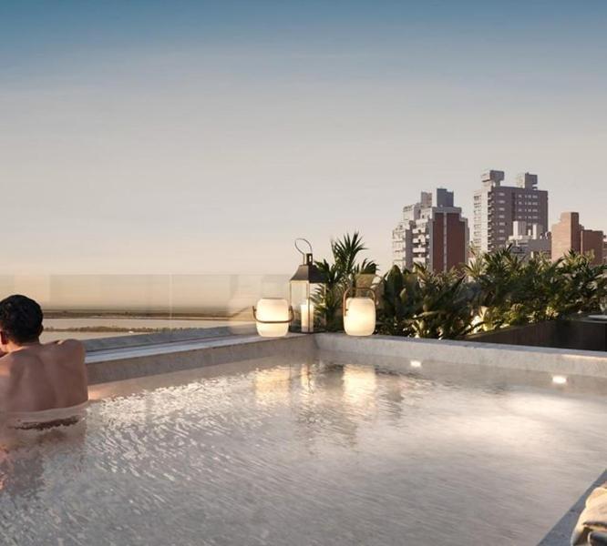 Departamento zona río dos dormitorios con patio exclusivo pileta y parrillero