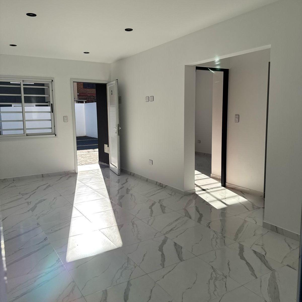 DEPARTAMENTO 3 AMBIENTES A ESTRENAR EN PLANTA BAJA CON PATIO Y COCHERA