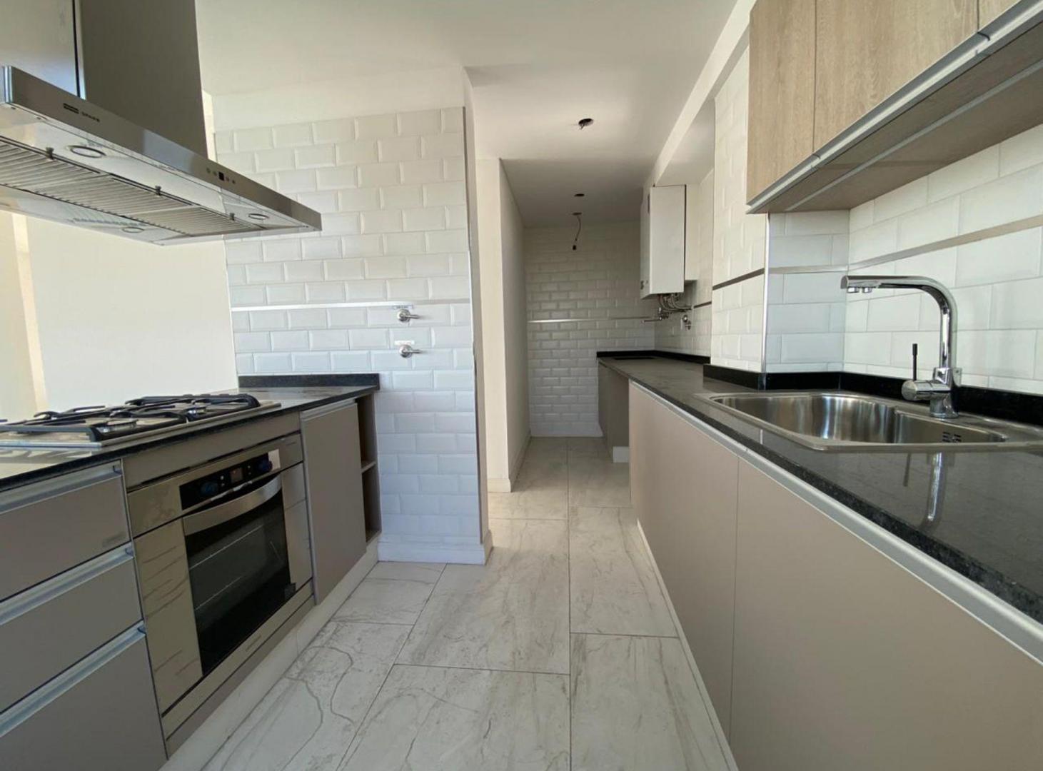 Foto de VENTA 3 AMB. A ESTRENAR CON COCHERA - LOMAS CENTRO, imagen 2