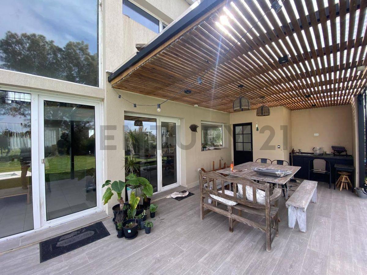 Foto de Casa en venta en Puerto Nizuc de tres dormitorios con parque y pileta, imagen 2