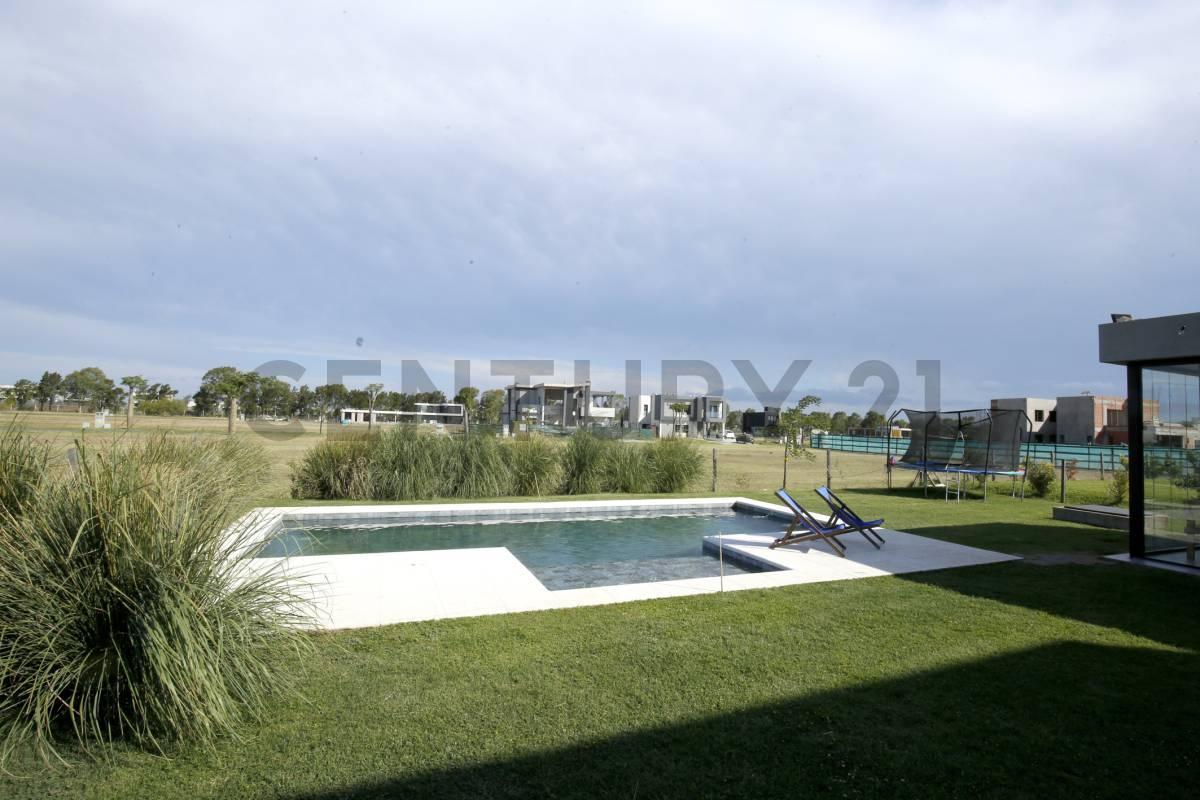 Foto de CASA EN VENTA EN PUERTO NIZUC - 4 DORMITORIOS+ESCRITORIO - QUINCHO, imagen 2