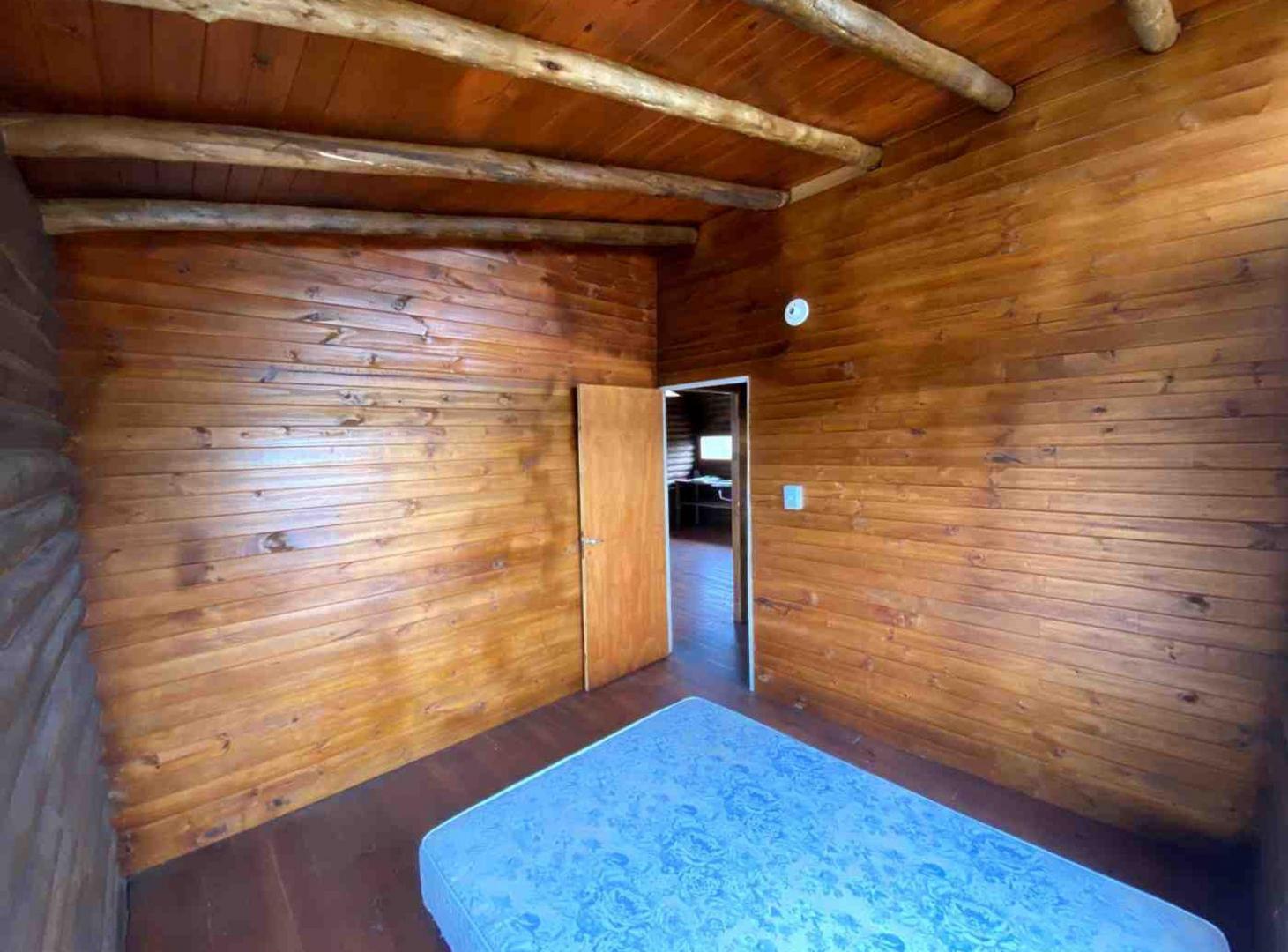 Foto de VENTA CABAÑA 2 DORM BARRIO SEMICERRADO LA FALDA, imagen 2