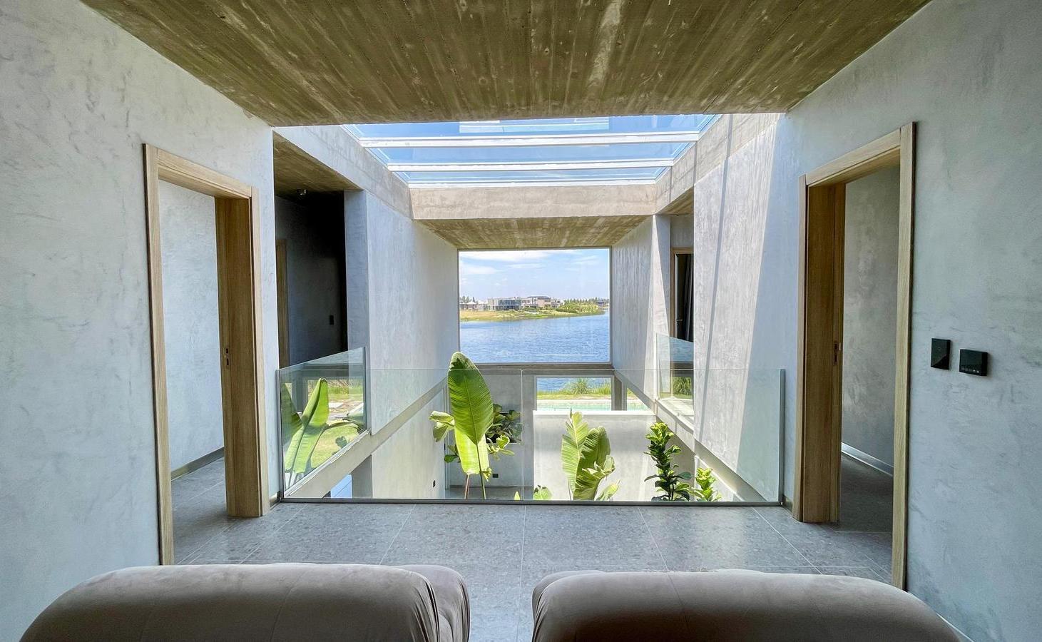 Foto de Retasada Casa en Naudir al lago central en venta - Con diseño, hormigon, imagen 5